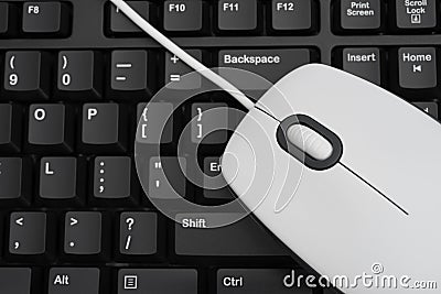 White mouse over keyboard Stock Photo