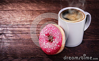 White mug of coffee and a donut on a wooden background Stock Photo