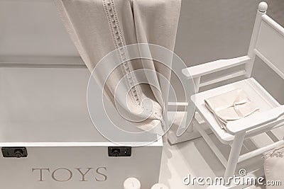 White natural wood furniture in the children`s room in the form of a drawer and rocking chair Stock Photo