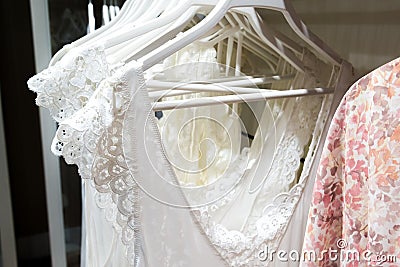 White nightgowns hang in store Stock Photo