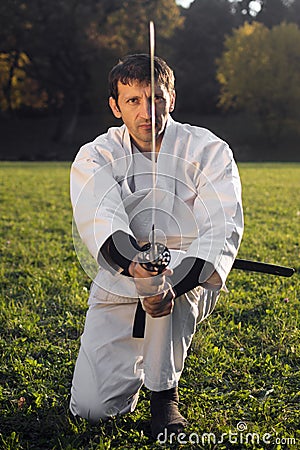 White ninja with sword Stock Photo