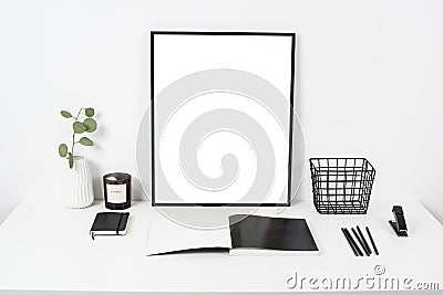 white office interior, stylish work table space with poster artw Stock Photo