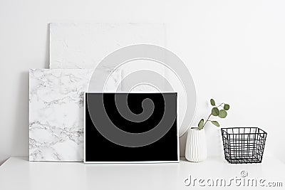 white office interior, stylish work table space with poster artw Stock Photo