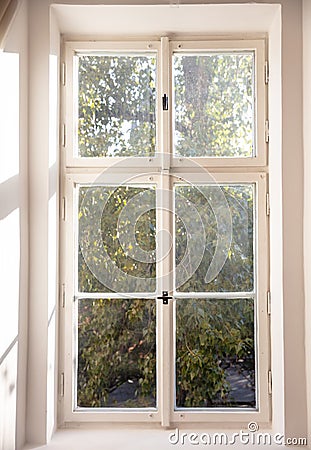 White old fashioned wooden window on white wall Stock Photo