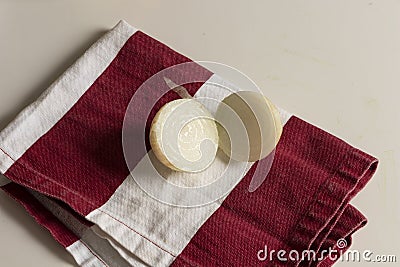 White Onion in half on red rag ready to prepare homemade food Stock Photo