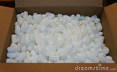 White packing peanuts inside a brown box Stock Photo