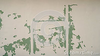 White paint falling of a green gips wall Stock Photo