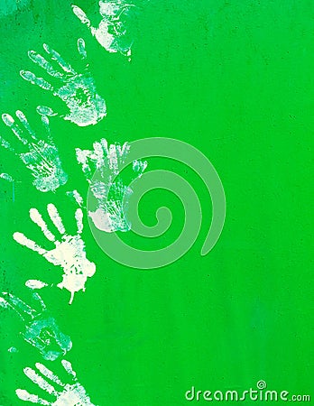 White paint hand print on green metal wall. Stock Photo