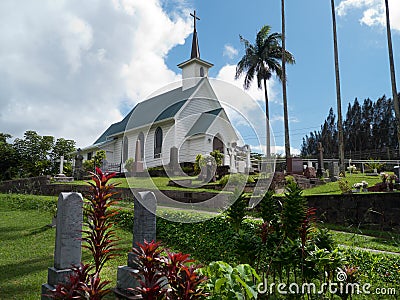 White painted small church against stormy sky Stock Photo