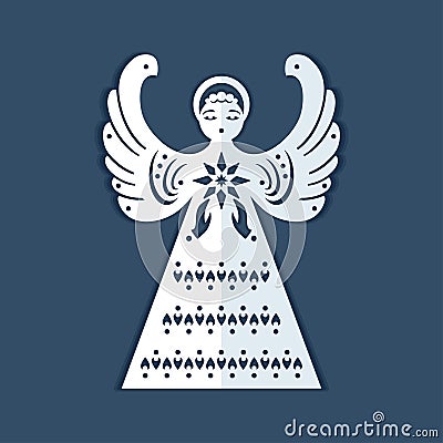 White paper angel with a christmas star on a dark blue background. Beautiful decor angel is form for carving. Stock Photo