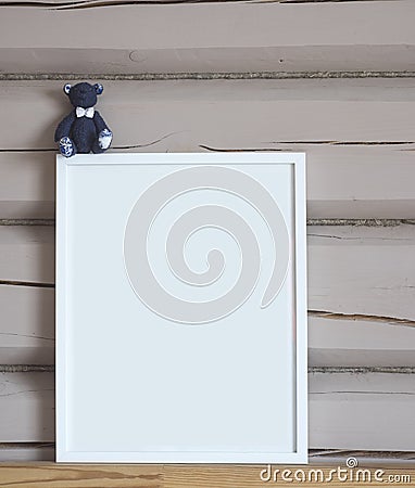 White paper blank interior poster, with blue bear toy, isolated vertical mock up with frame on beige wooden wall background, child Cartoon Illustration