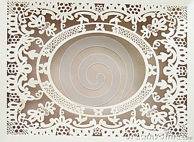 White paper hollow lace oval frame, done in the ornate and luxurious style on a pink background, place for text, room for copy Stock Photo