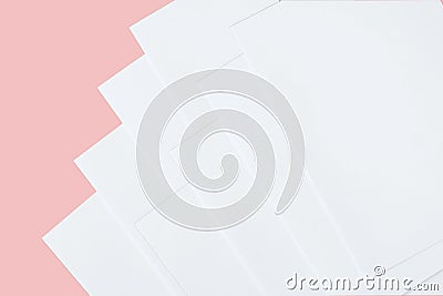 White paper mock-ups isolated on pink background, Blank portrait paper A4. brochure newspaper magazine, can use poster banners Stock Photo