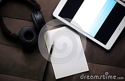 White paper and pencil on brown background Stock Photo