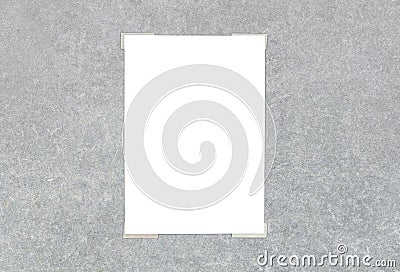 White paper sticked on gray wall Stock Photo