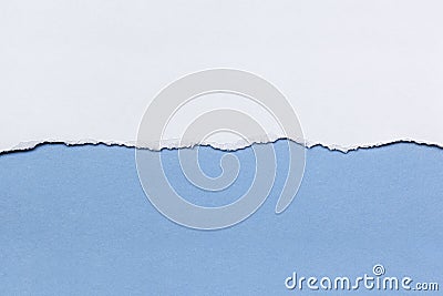 White Paper Tear over Blue Stock Photo