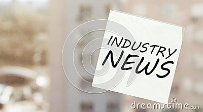 White paper with text Industry News on the window Stock Photo