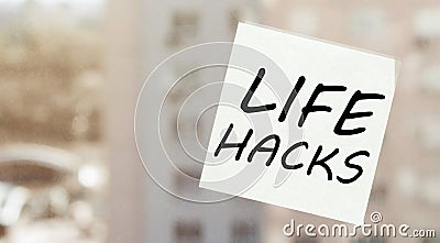 White paper with text Life Hacks on the window Stock Photo