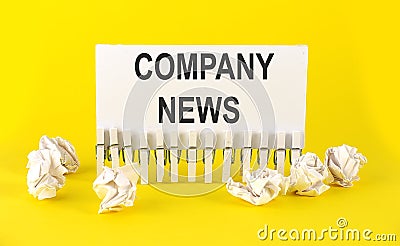 White paper on the yellow background with text COMPANY NEWS Stock Photo