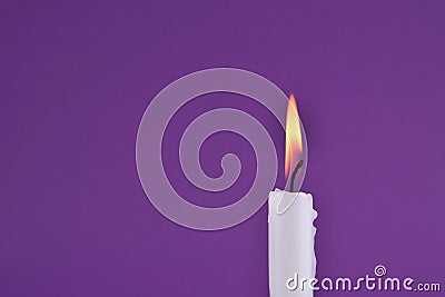 Radiant Glow: Captivating White Paraffin Candle Stock Photo