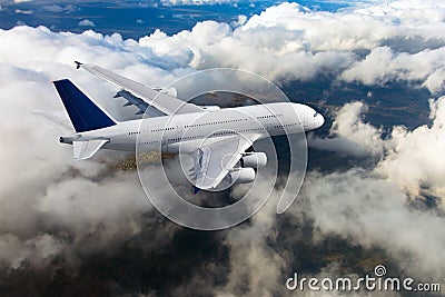 White passenger double decker plane in flight. Above view. Stock Photo