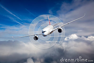 Passenger aircraft flies against a background of a cloudy sky. Aircraft left inclination. Stock Photo