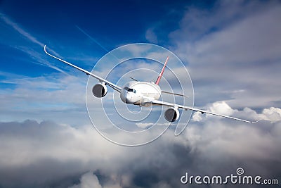 Modern passenger aircraft in flight. Right inclination. Front view Stock Photo