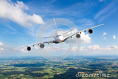 Passenger double decker plane flies against a background of a endless horizon. Aircraft left inclination / front view Stock Photo