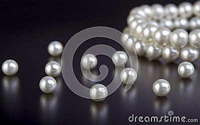 White pearls necklace on black Stock Photo