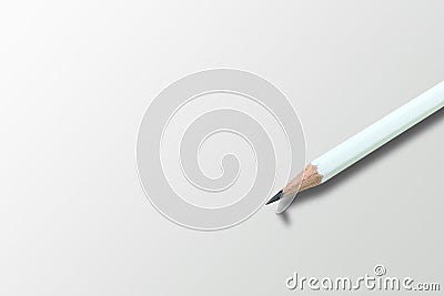White pencil on gray floor with shadow of broken head of sharp pencil. Stock Photo
