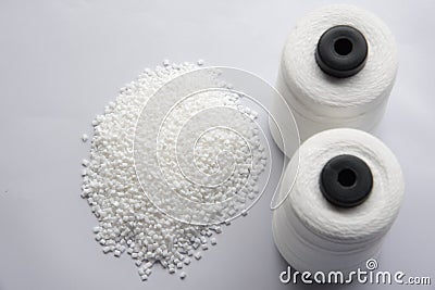 White Pet Chips Semi Dull,PET chips recycle,PET polyester chips &Raw White Polyester FDY Yarn spool Stock Photo