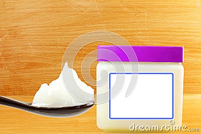 White petroleum jelly in spoon with jar Stock Photo