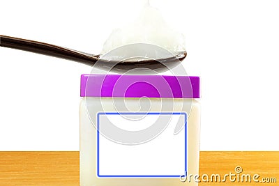White petroleum jelly in spoon with jar in white background Stock Photo