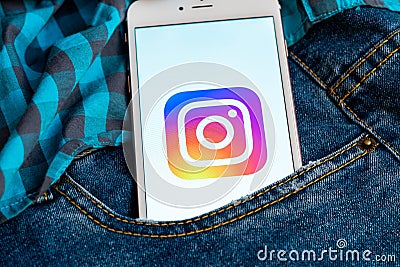 White phone with logo of social media Instagram on the screen. Social media icon. Editorial Stock Photo