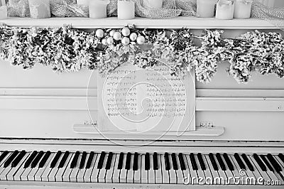White piano with candles. Happy winter holidays concept. Stock Photo
