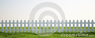 White picket fence on grass Stock Photo