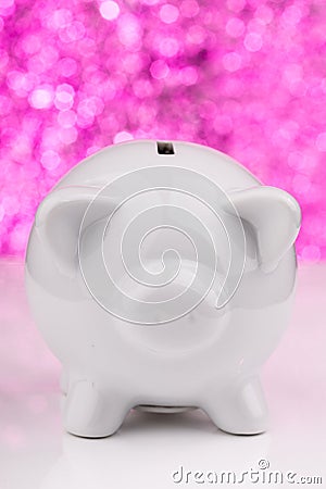 White piggy bank on pink background Stock Photo