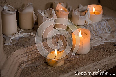 White Pillar Candle burning closeup. Stock Photo