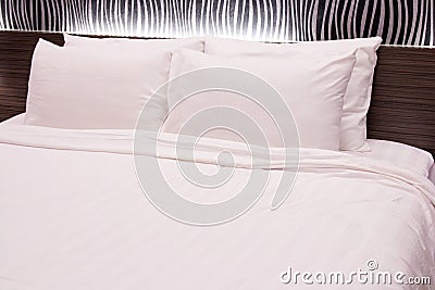 White pillow on the bed Stock Photo