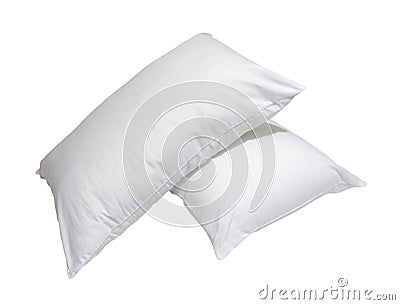 White pillows in stack in hotel or resort room isolated on white background with clipping path. Concept of confortable and happy Stock Photo