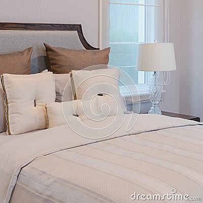 White pillows on white bed with luxury lamp Stock Photo