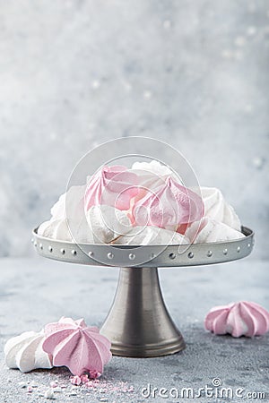 White and pink meringues on cake stand Stock Photo