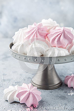 White and pink meringues on cake stand Stock Photo
