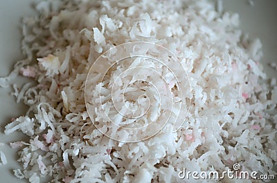 White and pink natural coconut flakes Stock Photo