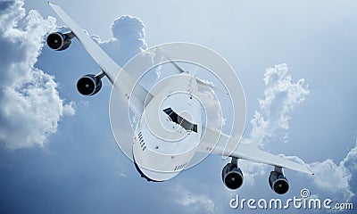 White plane flying in sky and clouds. Airplane boeing 747 Stock Photo