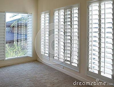 White plantation style wood Shutters Stock Photo