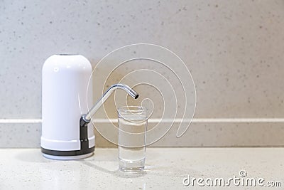 Electric rechargeable water pump for home or office use Stock Photo