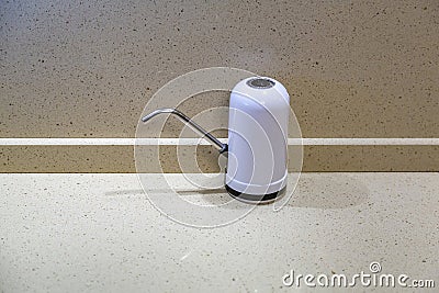 Electric rechargeable water pump for home or office use Stock Photo