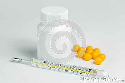 White plastic can with medicines and thermometer Stock Photo