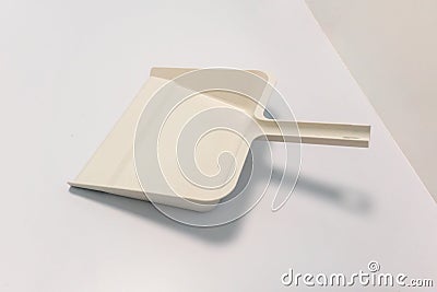 White plastic dustpan isolated on white Stock Photo